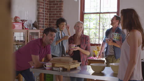 five friends laughing over coffee in kitchen, shot on r3d