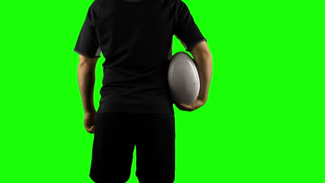 Serious-rugby-player-with-ball-