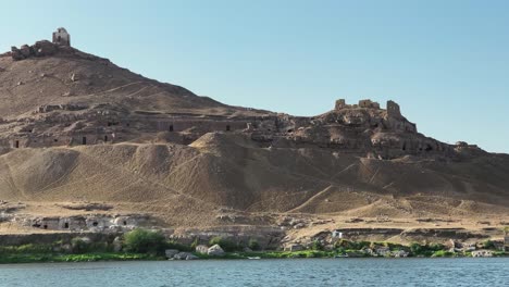 fantastic view from a cruise on the nile river, over the desert overlooking nubian tombs and ancient temples