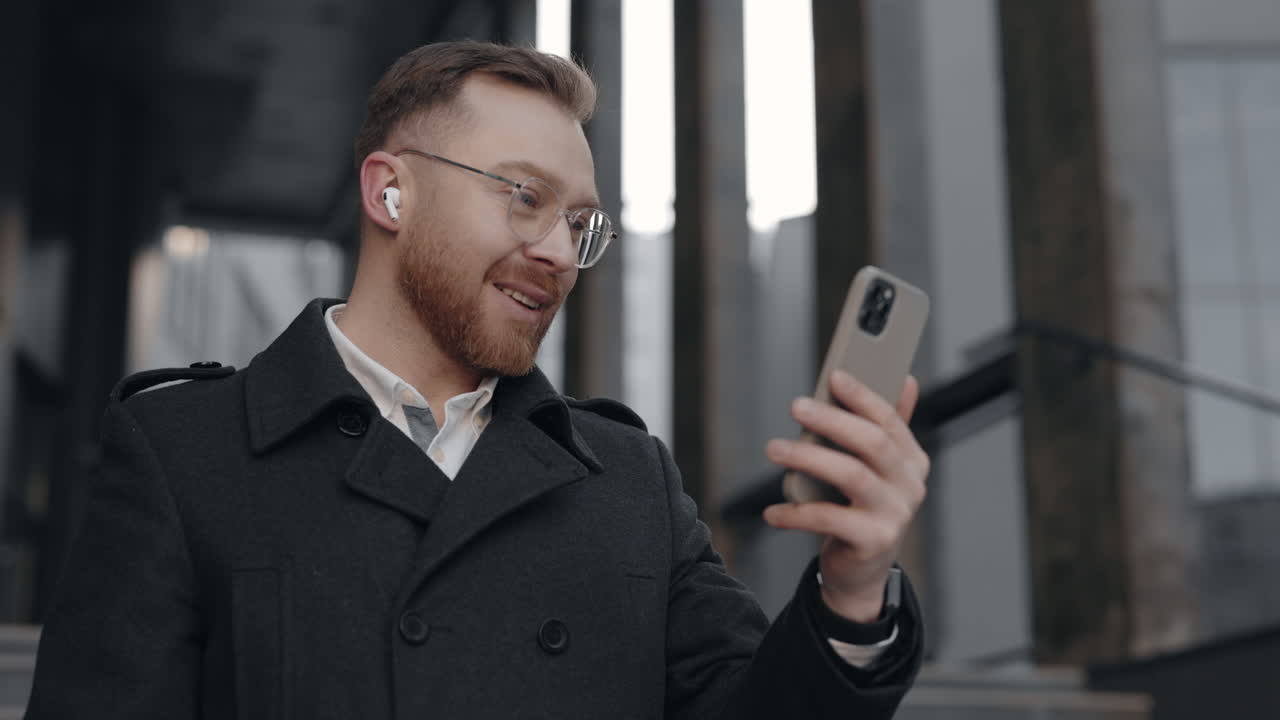Man on Video Call Outside Office Building