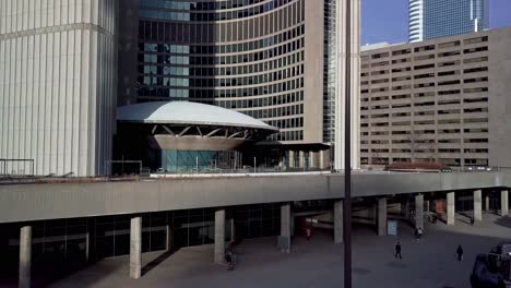 slow aerial reveal of modern architecture design at toronto city hall