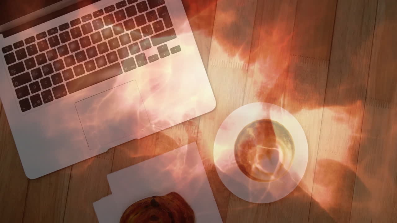Workspace being illustrated in 3D render showing flame light casting on laptop, coffee and pastry