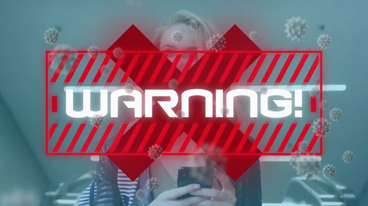 Animation of warning text and virus cells over woman wearing face mask