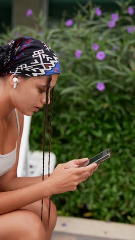 teenage girl using smartphone outdoors
