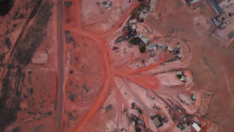 aerial of dirt roads in outback town, living underground