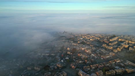 cinematic aerial footage of a misty morning, aerial shoot over small beautiful town