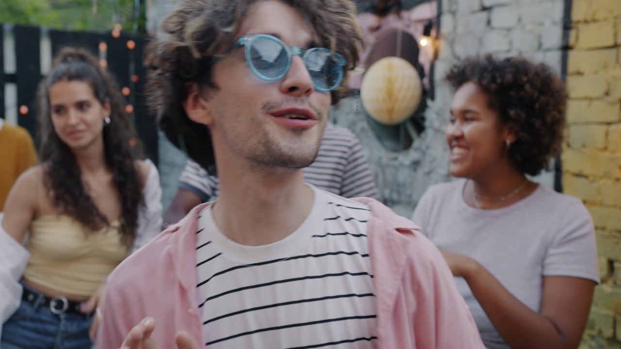 Group of friends dancing outdoors