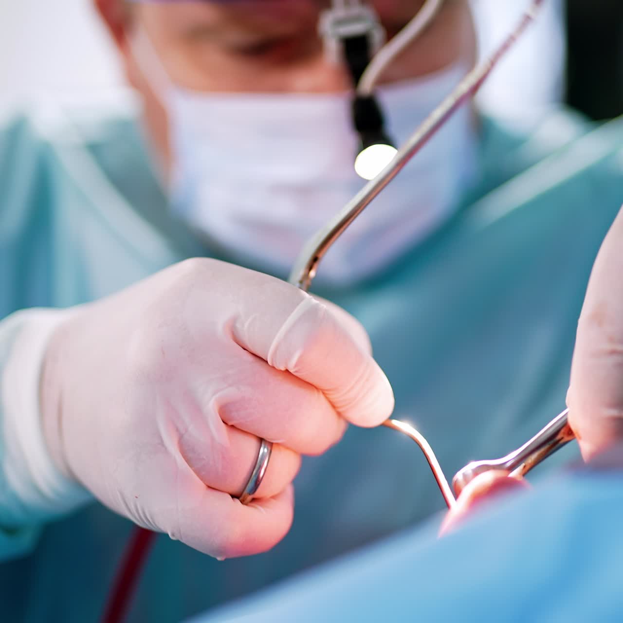 Metal tools in the nasal cavity of a patient. Male doctor performs functional rhinoplasty. Close up