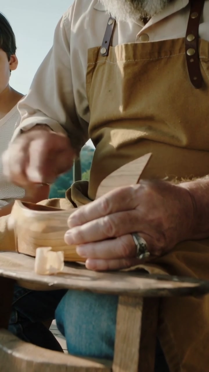 Skilled Craftsman Carving Wood with a Knife, Close-up
