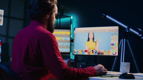 Freelancer-using-retouching-program-on-graphic-tablet-,-panning-shot