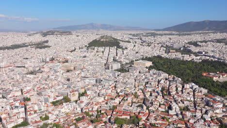 high aerial shot over central athens revealing the acropolis