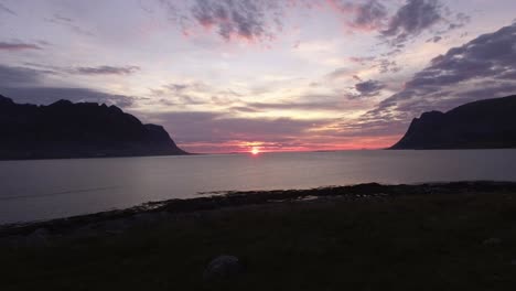 Aerial-of-a-fjord-at-sunset-on-Lofoten,-Norway