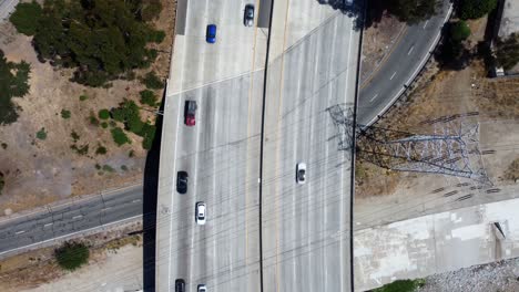 birds eye view drone shot cars driving on freeway for summer vacation