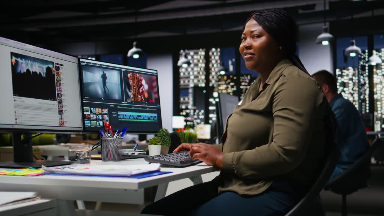 Female expert editor working in video production industry at agency office