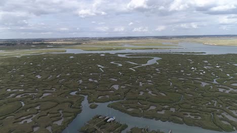 Aerial-push-in-over-Tollesbury-Marina,-Essex