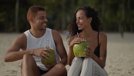 couple enjoying coconut drink