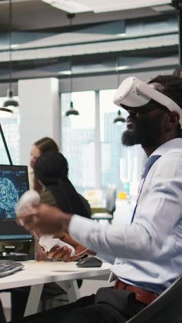 vertical video programmer wearing vr headset at office desk developing programs using ai