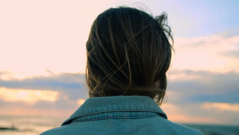 woman standing near railings at beach 4k