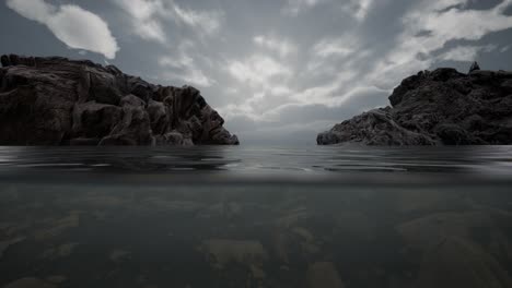 Medio-Bajo-El-Agua-En-El-Mar-Del-Norte-Con-Rocas