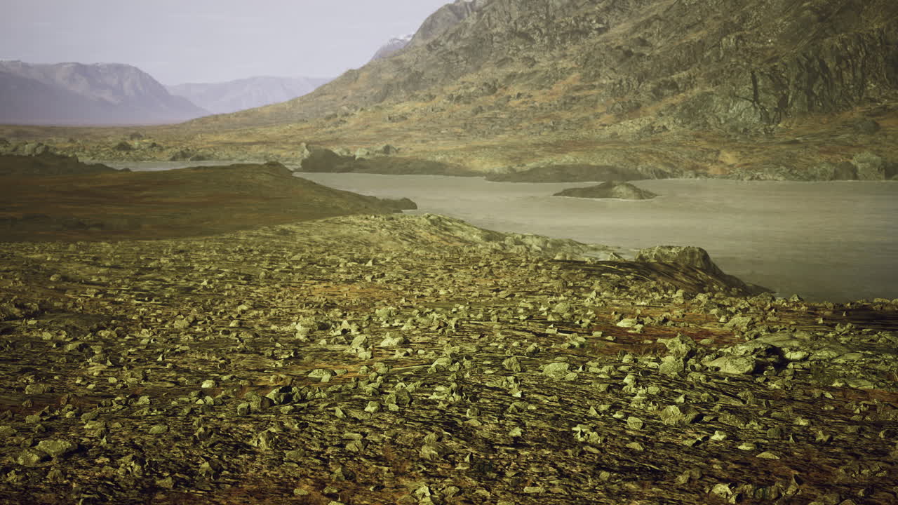 Alien landscape with rocky terrain and distant mountains under haze