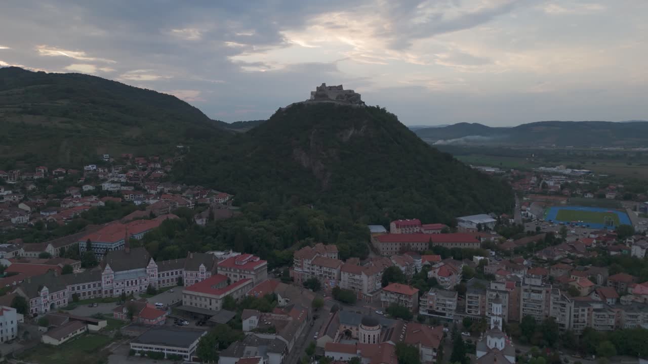 Cityscape drone view of Deva featuring the impressive fortress perched high above the town