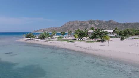 white-sand beach with clear blue water on a sunny summer day in puntarena, bani, dominican republic