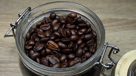 a zoom out of an ensemble of coffee roasted beans ready to be grounded