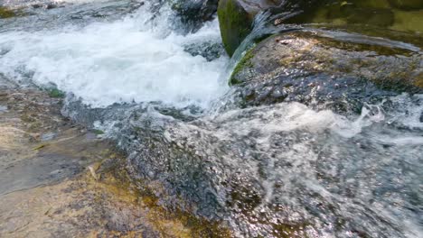 streams of crystal clear waterfall water