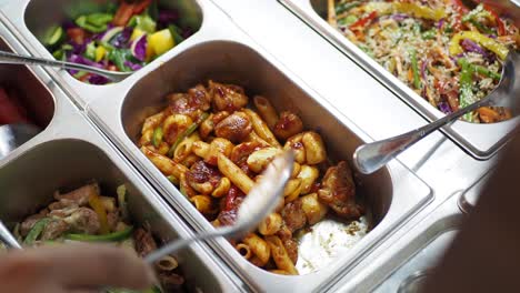 food buffet with pasta and salad