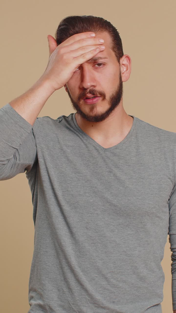 Unhealthy lebanese man coughing covering mouth with hand feeling sick allergy or viral infection