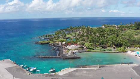 Aerial-descending-close-up-shot-of-the-ancient-Hawaiian-site-of-Kamakahonu-in-Kailua-Kona-on-the-Big-Island-of-Hawai'i