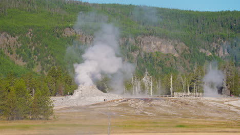 castle geyser erupting in yellowstone national park