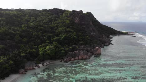 Aerial-view-of-Anse-Source-d’Argent,-La-Digue,-Seychelles-shot-in-the-early-morning-hours-with-no-people-on-the-beach