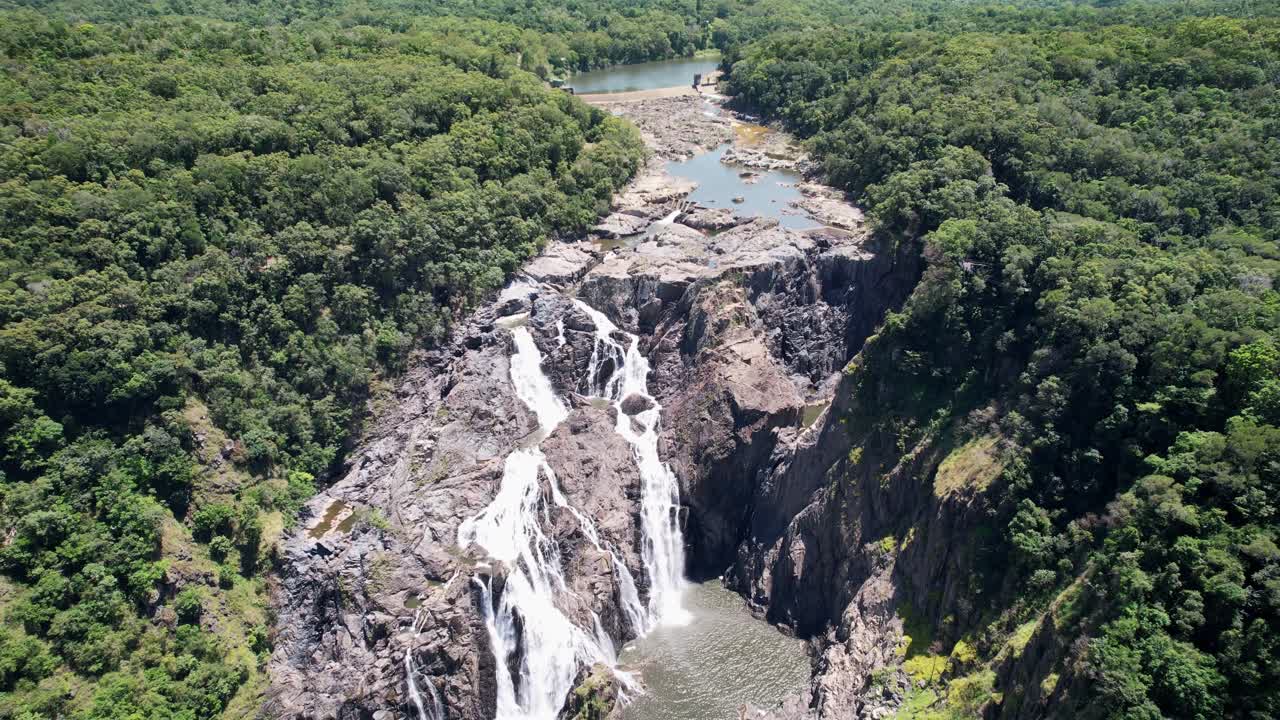 Barron falls with dam, forest, scenic tracks and tourist railway, aerial view