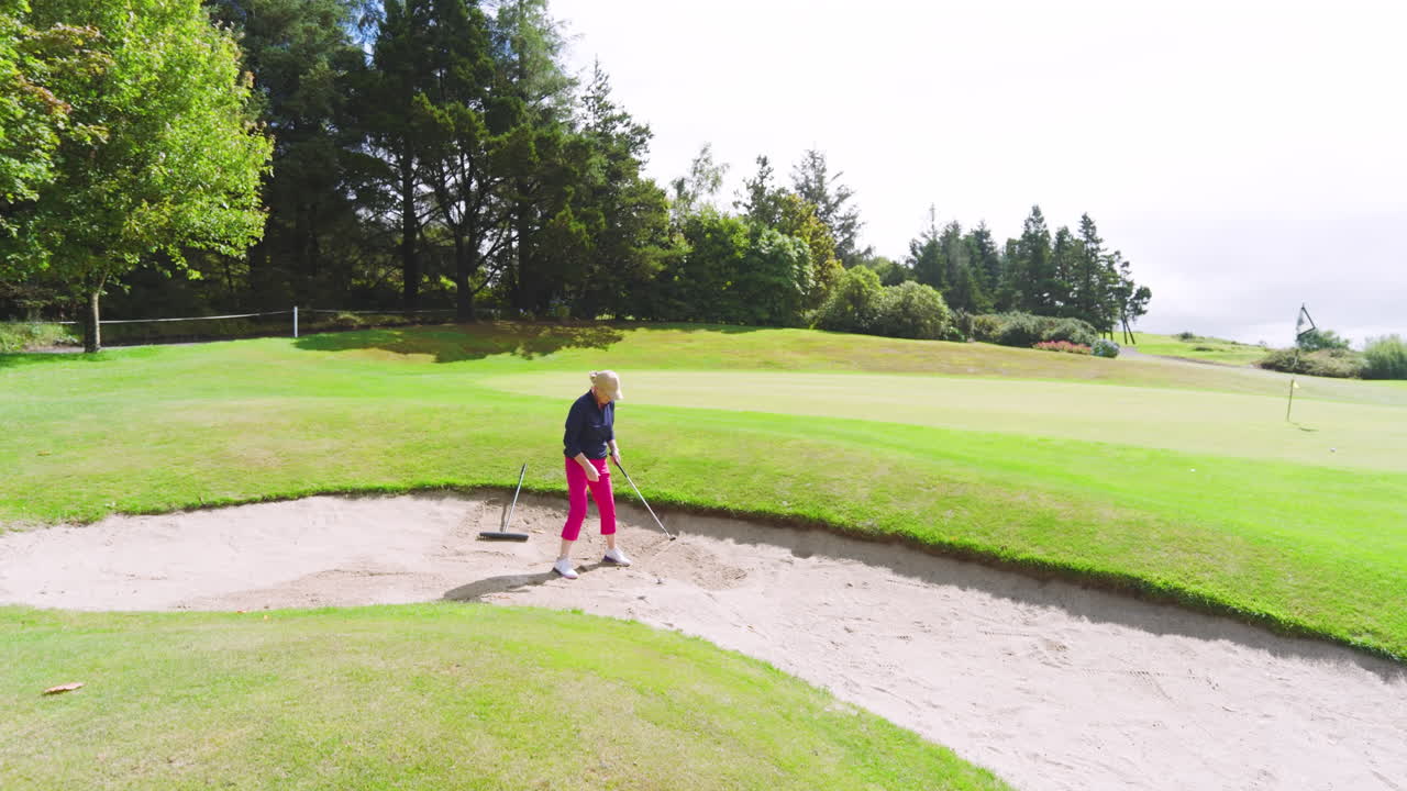 Golf players playing golf and knocking golf ball out on golf course on cloudy day