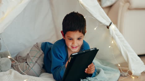 Tablet,-relax-and-boy-child-in-a-tent-playing