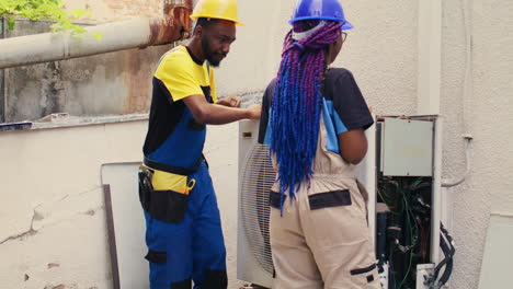 professionals working on air conditioner