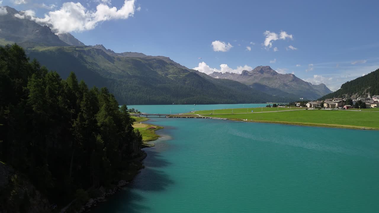 Aerial view of Lake Silvaplanersee and the surrounding residential area in Silvaplana, Graubünden, Switzerland.