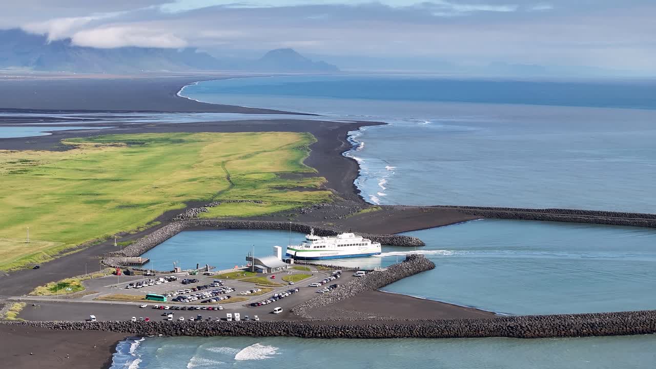 Ferry in a Port near a Black Sand Beach in Iceland