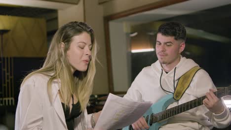 two musicians working in music studio