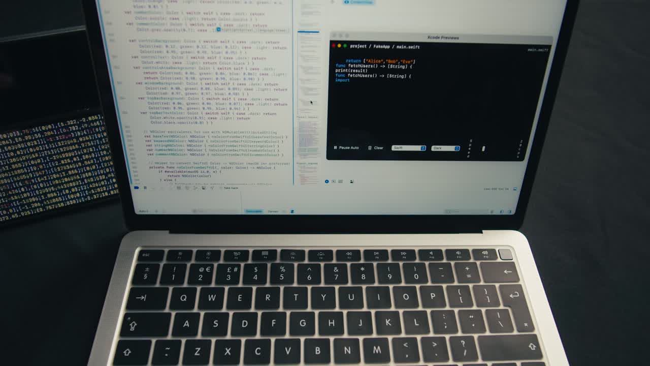 Developer's Hands Typing Code on Laptop Keyboard