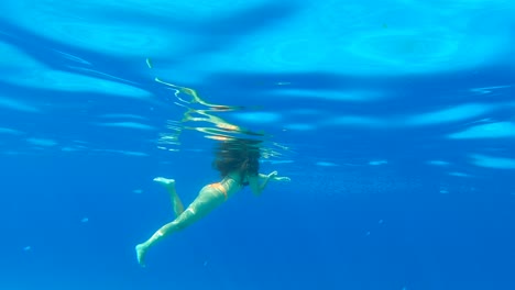 girl swiming in blue waters greece fish summer snorkeling