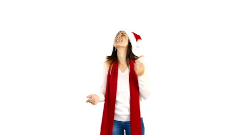 Woman-in-santa-hat-and-warm-clothing-looking-upwards