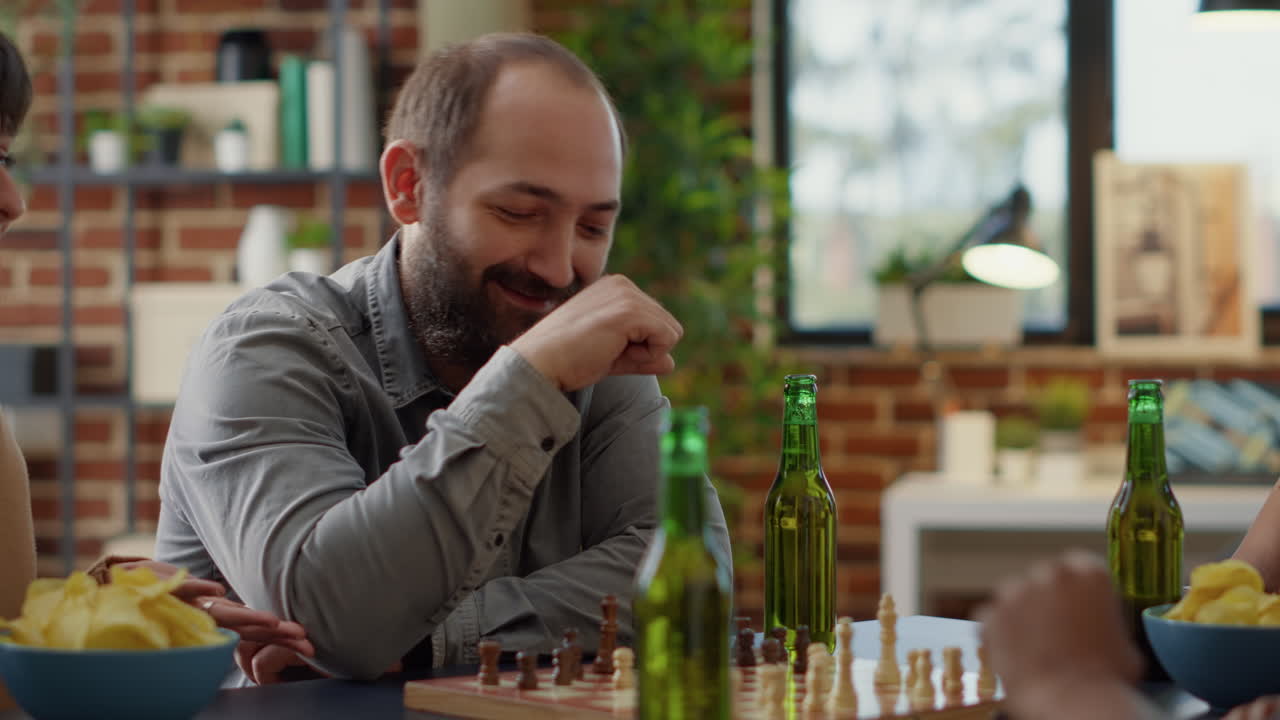 Diverse group of friends having fun with chess board games