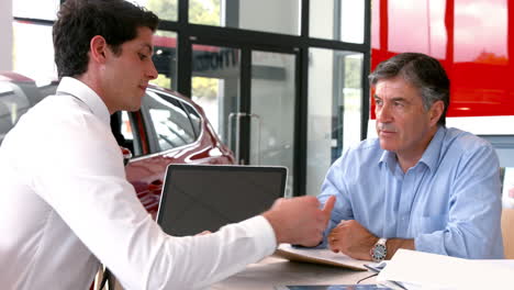 businessman explaining the car details