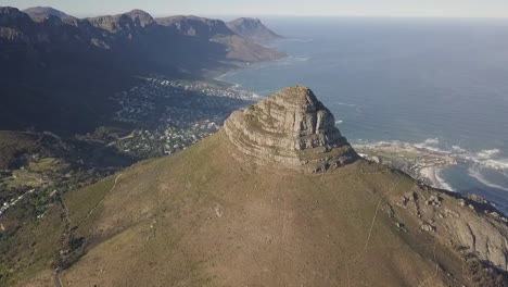 Lion's-Head-mountain-rises-high-over-Cape-Town-in-South-Africa,-aerial