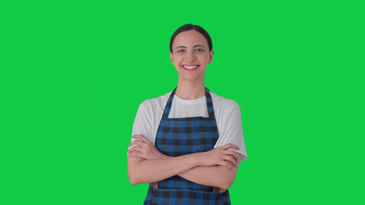 Ritratto di casalinga indiana felice Green screen