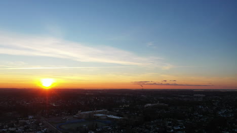 An-aerial-shot-over-a-suburban-neighborhood-at-sunrise