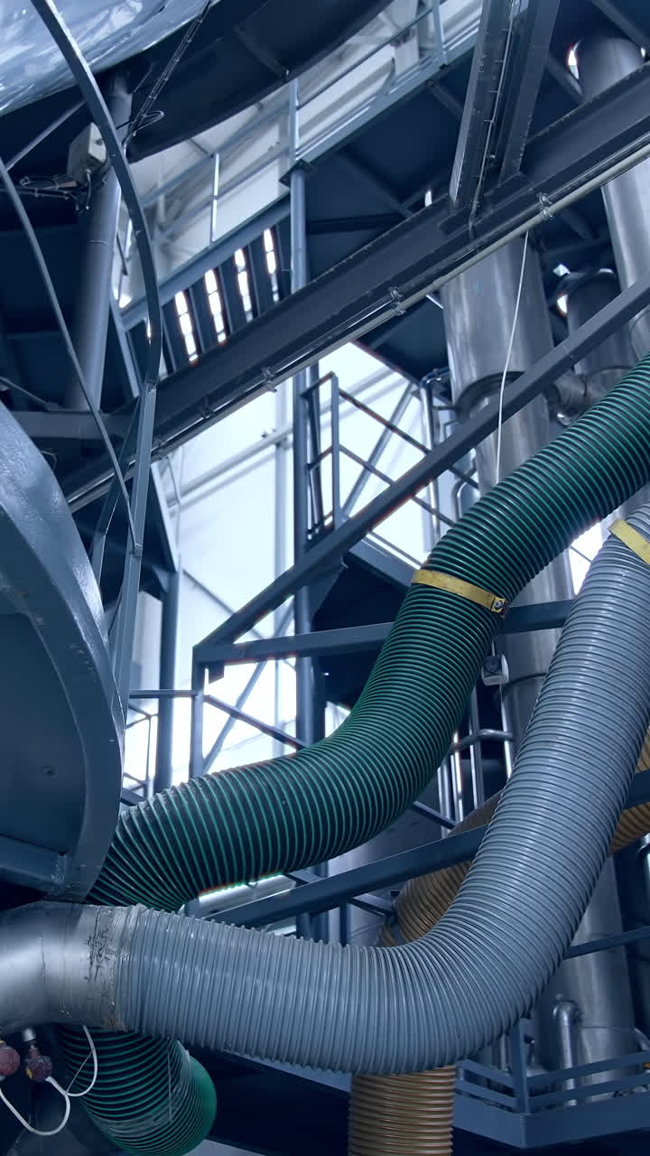 Milk making in modern technologies. Modern steel construction for making cheese. Vertical video