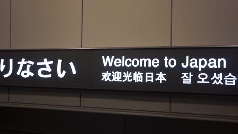 &quot;welcome to japan&quot; sign at arrival of tokyo narita international airport